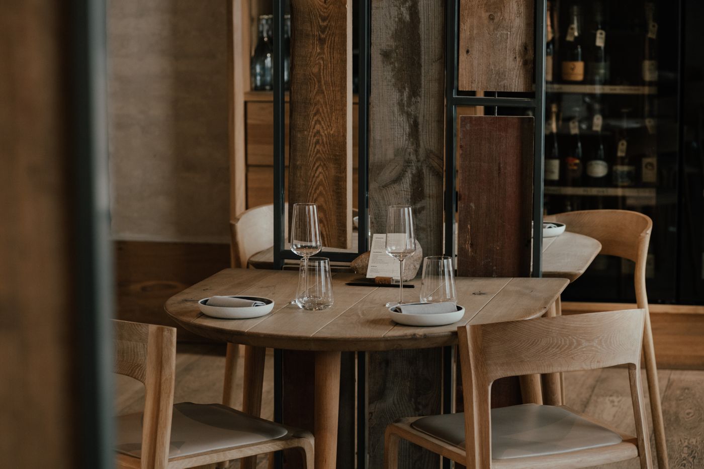 A set table among oak and steel